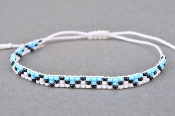 A bracelet made of threads and beads is a talisman that will bring the owner good luck