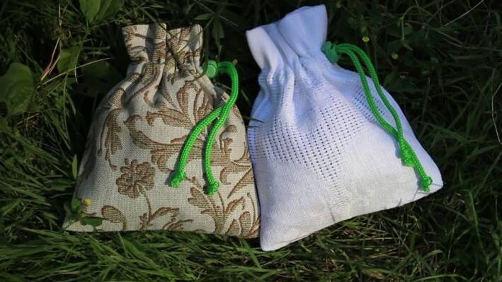Homemade bags with herbs and stones, attracting business success